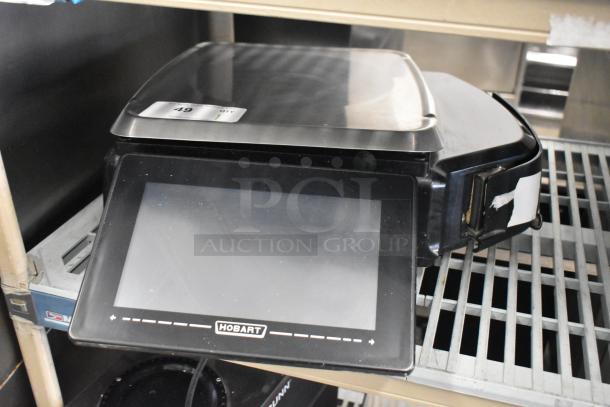 2017 Hobart HTi-7LH26 metal commercial food portioning scale, black finish, touchscreen, tested working, for countertop use.