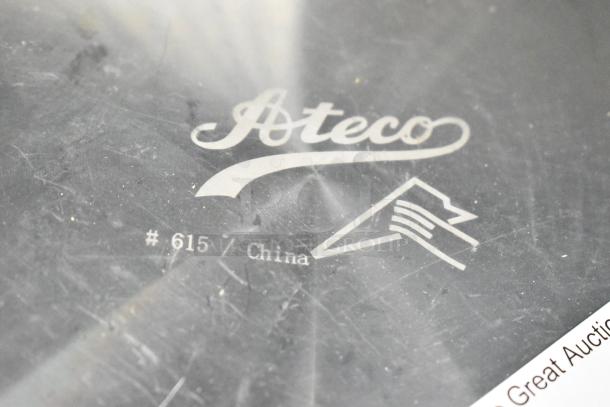 Ateco 615 12" aluminum cake turntable, labeled. Features non-slip base, minor surface wear visible. Made in China.