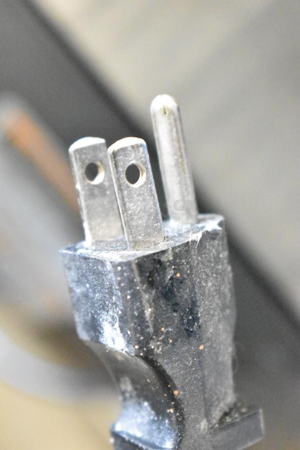 The image shows a close-up of the plug of a Bunn VPR coffee machine.