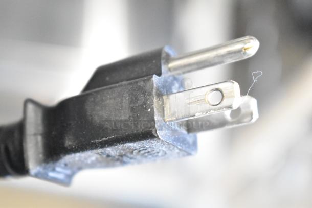 Close-up of a power plug for a Sharp Countertop Microwave Oven. Door stuck closed, 120 volts, 1 phase.