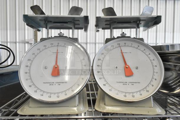 Three various scales including two analog temperature-compensated models, displaying clear dials and metal casings.