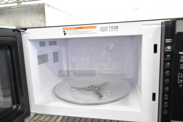 Hamilton Beach HB8436193153-09 countertop microwave oven, 1000 watts, 120V, 1 phase, interior view with glass turntable.