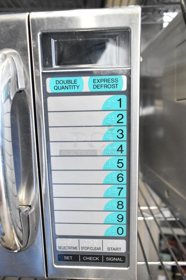 Sharp R-21LVF commercial countertop microwave oven with keypad featuring double quantity and express defrost options.