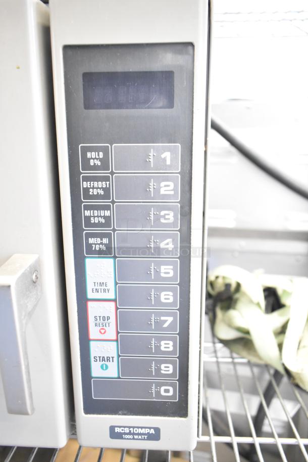 Amana RCS10MPA Commercial Microwave Oven, keypad close-up. 120 volts, 1 phase. Control panel with multiple settings.