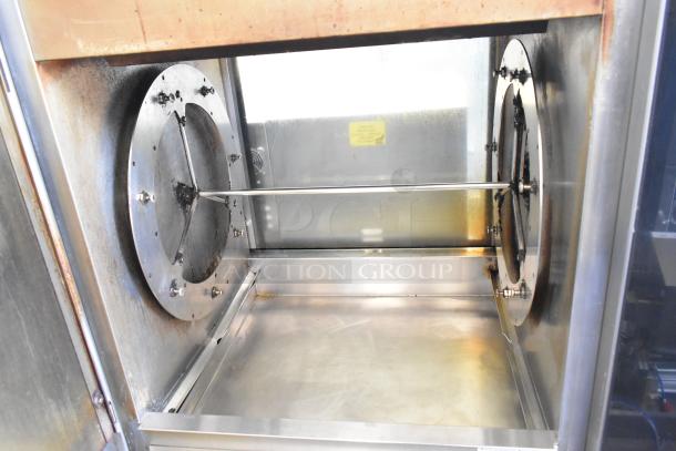 Fri-jado commercial electric rotisserie oven with 208V, 3-phase power, interior view, mounted on commercial casters.