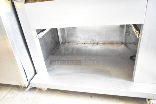 Fri-jado commercial electric rotisserie oven on casters, 208V, 3 phase, stainless steel, showing interior condition.