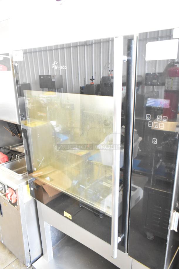 Fri-jado commercial electric rotisserie oven on casters, 208V, 3-phase; features a glass door and control panel, sturdy condition.