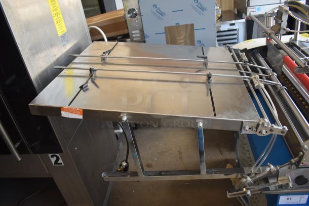 Commercial paper tube labeling machine, stainless steel, 208/250V, 1 phase, visible control panel, excellent condition.