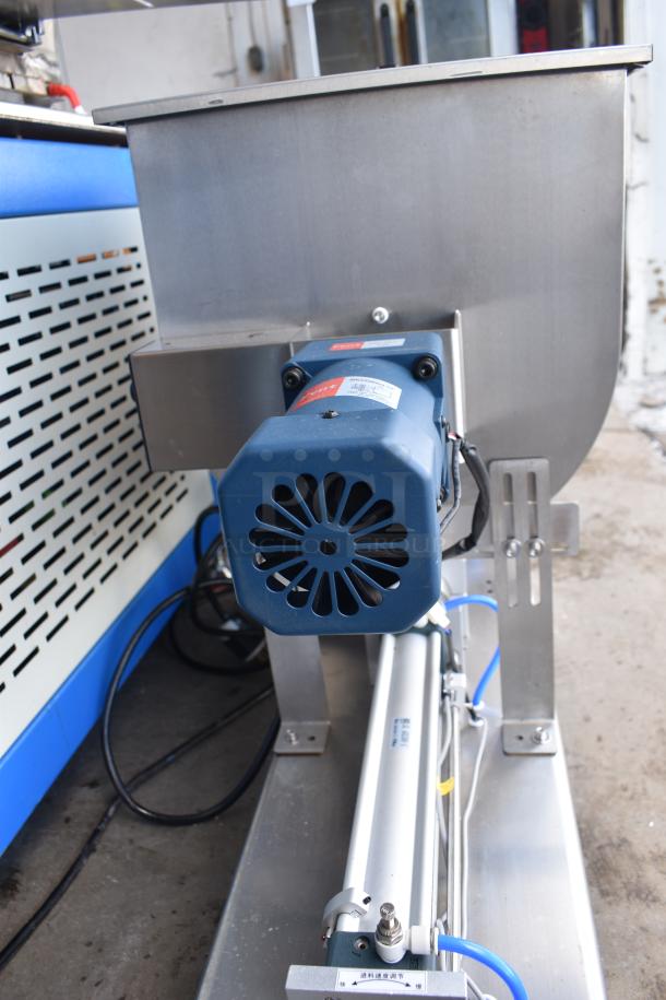 G1WG Countertop Quantitative Filling Machine, 100 Volts, 1 Phase, in metal casing. Features pneumatic cylinder and visible wiring.