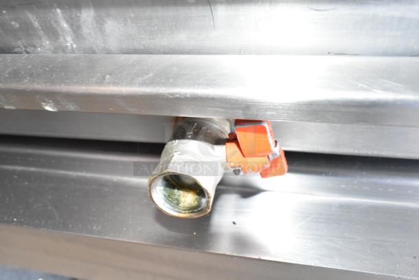 Fri-jado TDR7-P rotisserie oven spigot detail, showing red valve handle. Stainless steel. 208V, 3 phase on casters.