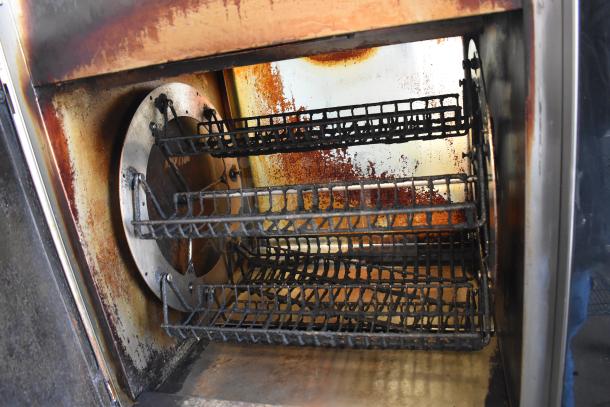 Fri-jado TDR7-P commercial rotisserie oven with three baskets, floor model, on casters, shows signs of wear, 208V, 3-phase.