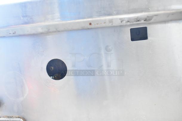 Southbend gas-powered flat top griddle, stainless steel surface, worn with visible marks, suitable for commercial use.