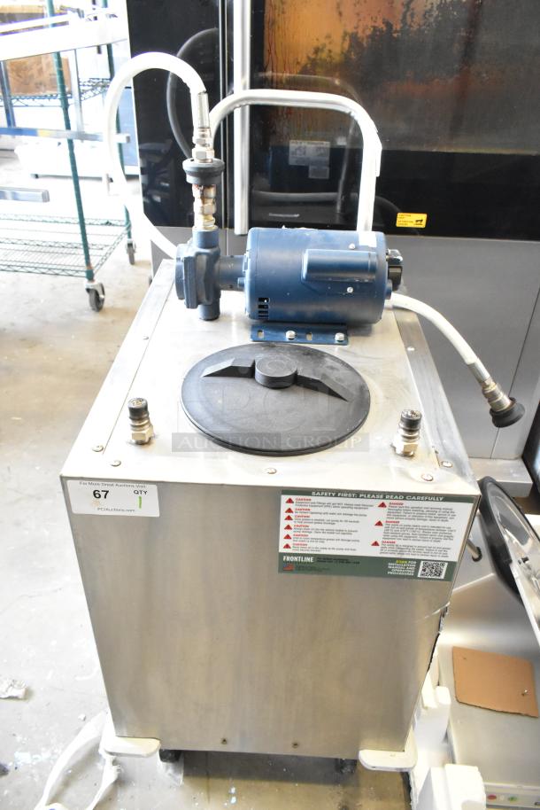 Frontline commercial fryer oil transport on casters with motor, hoses, and safety labels; durable and easy mobility.