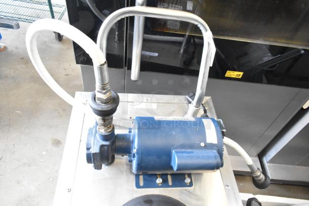 Frontline Commercial Fryer Oil Transport on casters, features durable metal construction, hoses, and pump, in good condition.