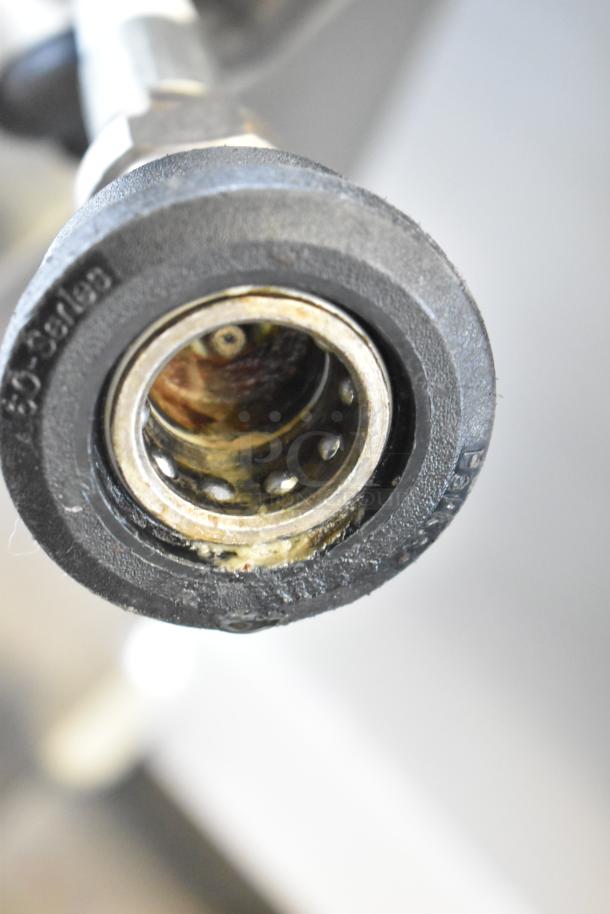 Frontline Commercial Fryer Oil Transport nozzle, showing detailed view of connector and condition, mounted on casters.