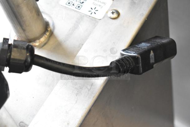 Frontline Commercial Fryer Oil Transport on casters, stainless steel body with power cord attached. QR code and label visible.