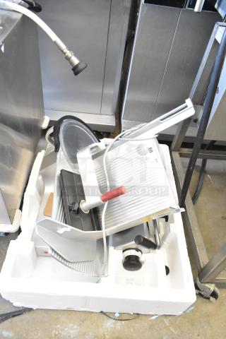 Bizerba GSP H commercial countertop meat slicer, 120 volts, 1 phase, lightly used. Features precision blade and adjustment knob.
