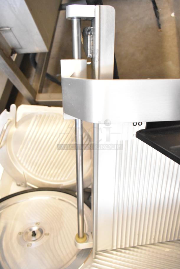 Bizerba GSP H meat slicer, stainless steel, 120 volts, commercial use. Features precision blade, sturdy build, lightly used.