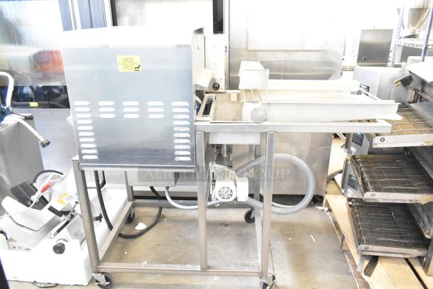 Belshaw Adamatic TG-50 Thermoglazing Station, stainless steel, commercial casters, 208V, 1 phase, clean, caution label visible.