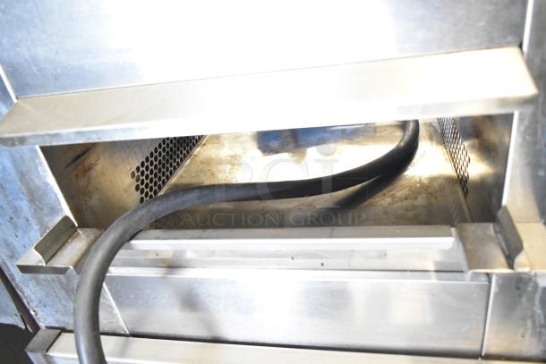 Belshaw Adamatic TG-50 stainless steel thermoglazing station with commercial casters, 208V, 1 phase, inside view.