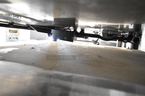 2019 Rational SCC WE 62 commercial combi convection oven bottom view, showing double pan rack equipment stand.