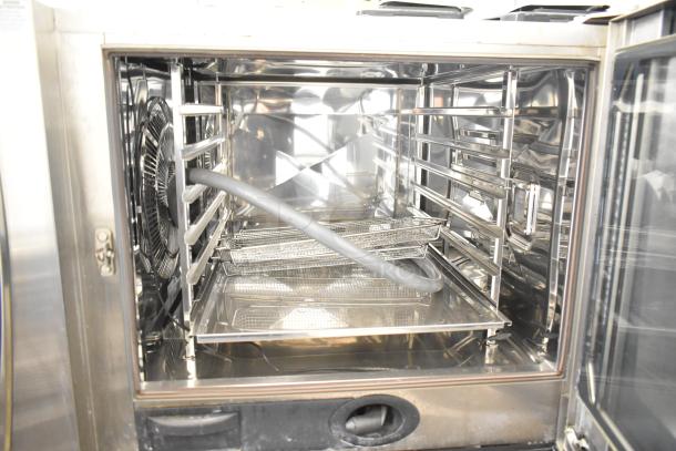 2019 Rational SCC WE 62 stainless steel commercial combi convection oven, excellent condition, on double pan rack stand.