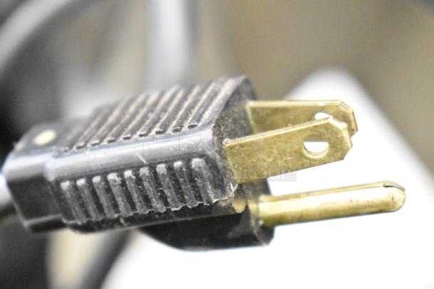 Close-up of a three-prong power plug for the Jun-Air 87R-4MN1-HSBHH nitrogen generator, 120V, 1 phase.