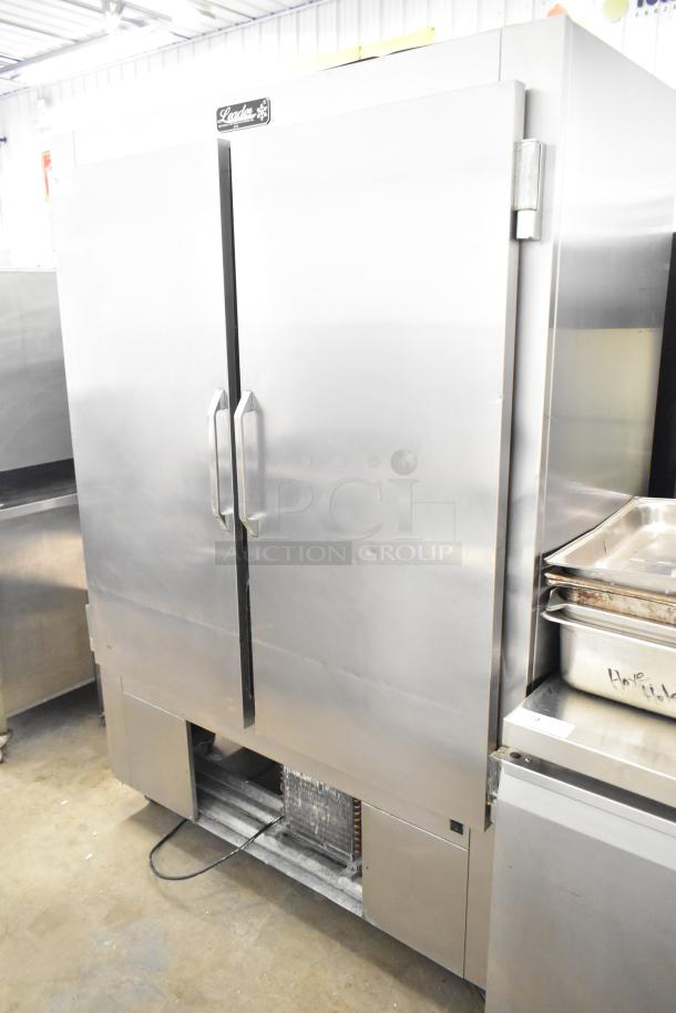 Leader LR54 S/C Commercial 2 Door Reach In Cooler. Stainless steel, 115 Volts, 1 Phase, visible logo, sturdy handles.