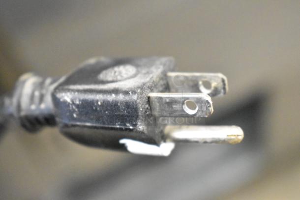 Close-up of a power plug from the Leader LR54 S/C Commercial 2 Door Reach In Cooler, 115 Volts, 1 Phase.