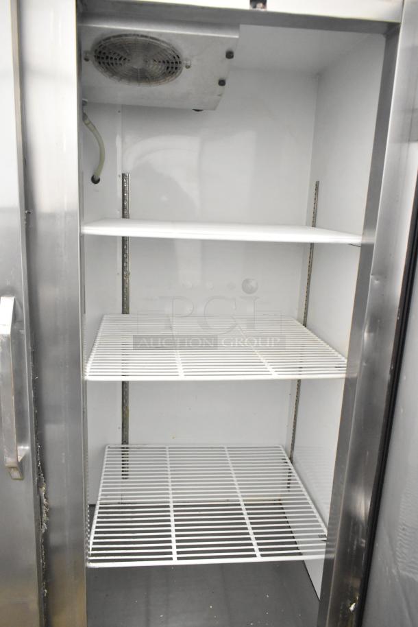 Leader LR54 S/C Commercial 2 Door Reach In Cooler, 115V, 1 Phase. Features adjustable shelves. Shows interior view.