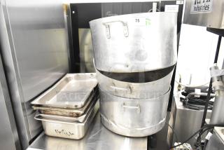 8 kitchen items including 3 metal stock pots with handles, showing wear; includes stainless steel drop-in bins.