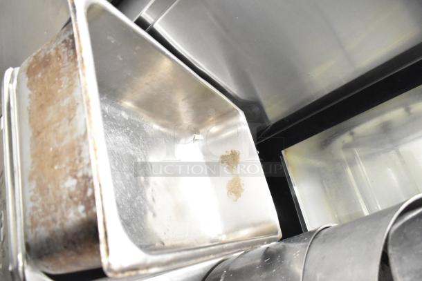 Metal drop-in bin with visible wear and marks. Part of an auction lot including 3 stock pots. Sold as eight items.