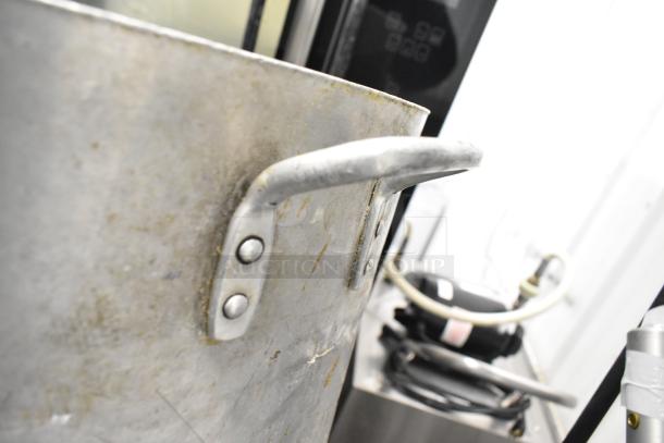 8 kitchen items including a large metal stock pot with riveted handles and visible wear, plus drop-in bins.