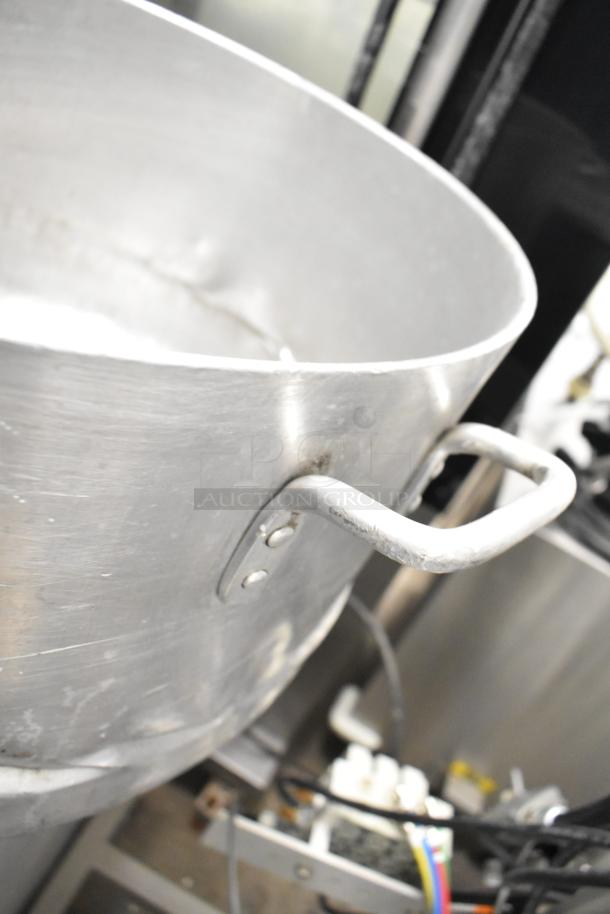 Large metal stock pot with handle, part of an auction lot of 8 items including drop-in bins. Slight wear visible.