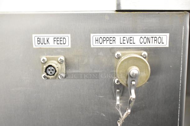 Per-fil Micro-15 floor filler machine with bulk feed and hopper level control, 125 volts, on commercial casters, good condition.