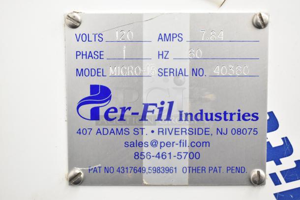 Per-fil Micro-15 filler machine label showing 120 volts, 1 phase, model 40360. Contact info: Riverside, NJ, sales@per-fil.com.