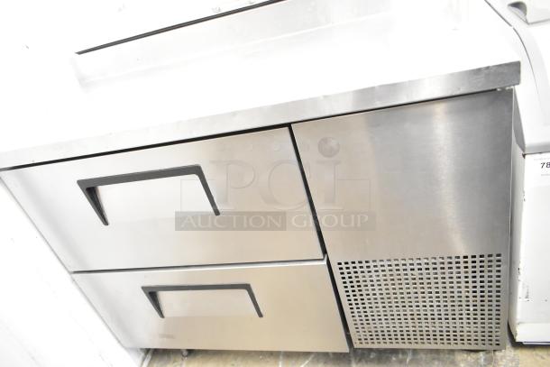 2017 True TPP-44D-2 commercial pizza prep table with 2 drawers, stainless steel, on commercial casters, 115 volts, 1 phase.