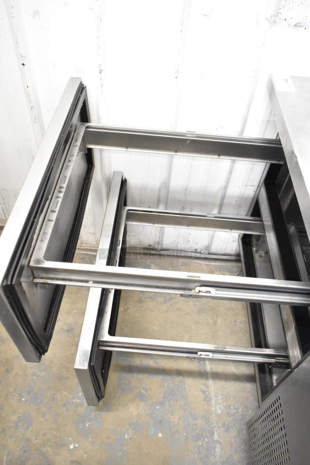 2017 True TPP-44D-2 pizza prep table with two open drawers, commercial casters; stainless steel, 115V, 1 phase.