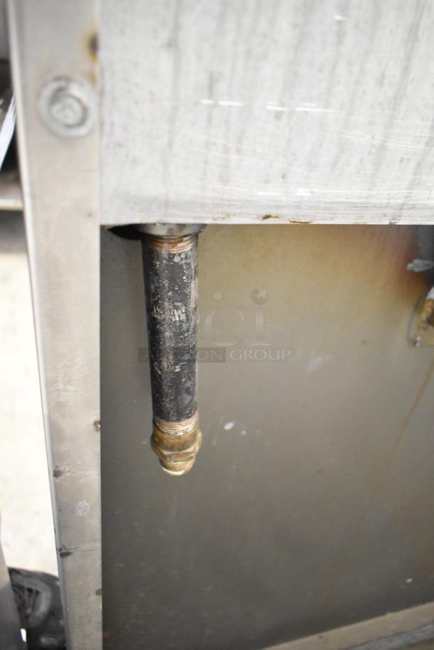 Jade Range JSR-36B-36 gas charbroiler with oven and backsplash, showing connection pipe, used condition.