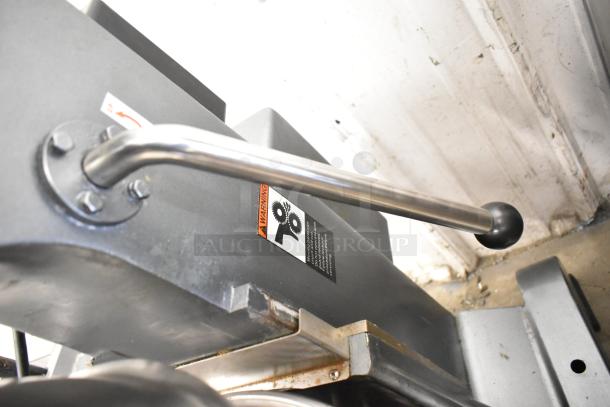 Avantco MX40 commercial 40-quart planetary dough mixer, visible warning label, stainless steel handle, industrial use.