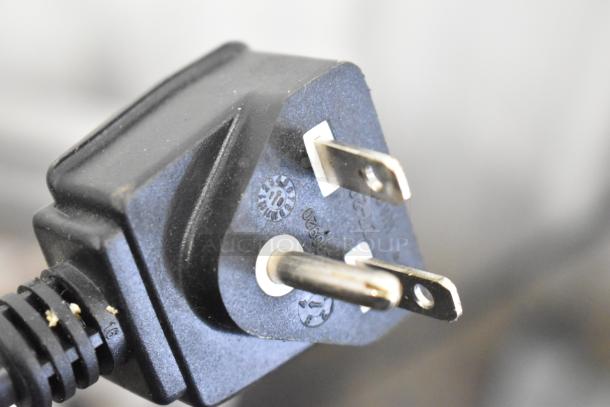Close-up of a power plug for the Avantco MX40 240V mixer. Visible markings show voltage and safety certifications.