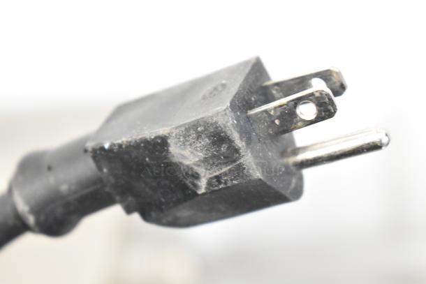 Close-up of power plug for Winco ECT-300 Commercial Countertop Conveyor Toaster, showing standard three-prong design.