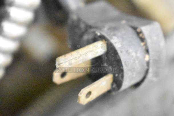 Close-up of a power plug from a Delfield Commercial 2 Drawer Chef Base, 115 Volts, 1 Phase.