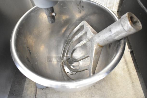 Hobart commercial countertop planetary dough mixer with mixing bowl and paddle attachment. 115 volts, 1 phase.