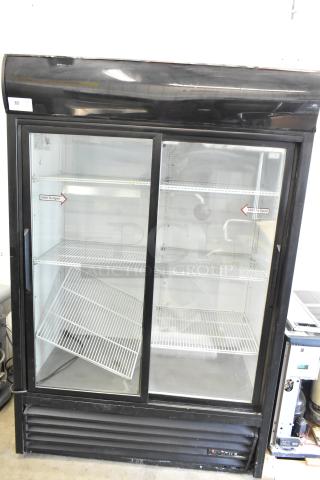 True GDM-45 commercial 2-door cooler merchandiser, 115V, 1 phase, glass sliding doors, metal shelves, used condition.