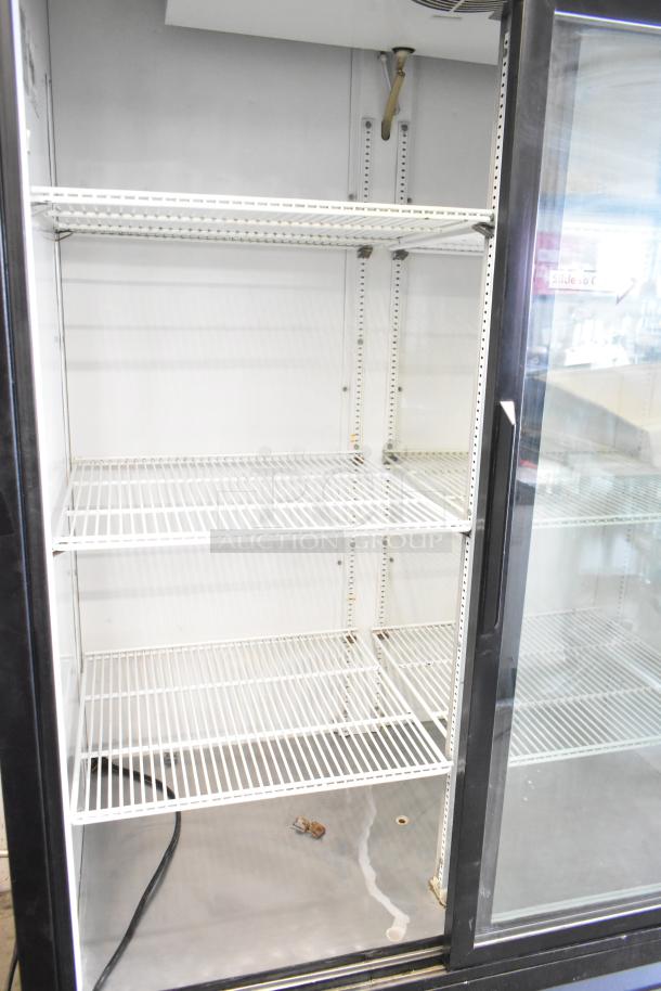 True GDM-45 Commercial 2 Door Cooler Merchandiser, 115V, 1 Phase. Features glass doors, adjustable shelves.