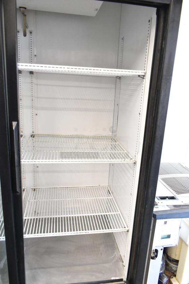 True GDM-45 commercial 2-door reach-in cooler merchandiser, 115 volts, 1 phase, featuring adjustable shelves.