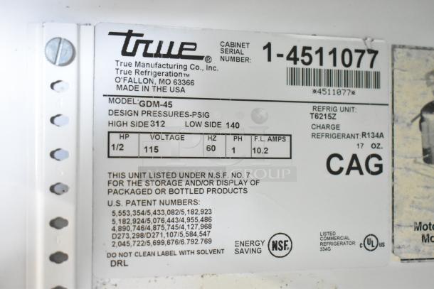 True GDM-45 commercial cooler, 2-door, 115 Volts, 1 Phase. Features manufacturer's label showing model and specifications.