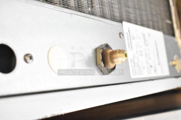 2018 Scotsman F1222A-32E ice machine connection port, close-up view, Prodigy Plus® model label visible.