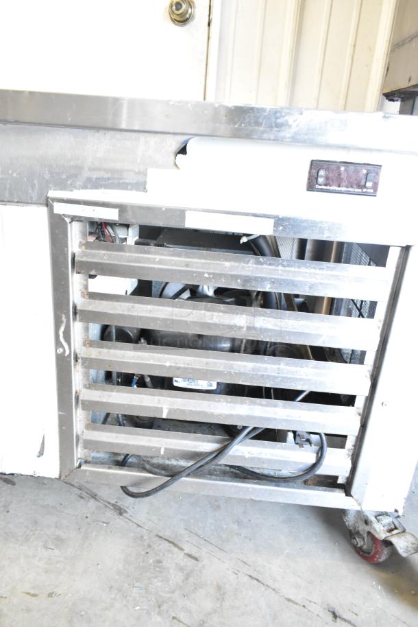 Cooltech CRI-52CF 2-drawer chef base on commercial casters, 115 volts, 1 phase. Features metal grate and visible wiring.